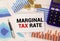 Text text Marginal Tax Rate. Word for A cost of an item or service which is usualy