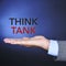 Text think tank in the hand of a man