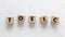 Text TOEIC on wooden cubes on white textured putty background. Abbreviation of `Test of English for International Communication