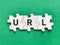 Text URL written on wooden jigsaw puzzle