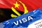 text VISA on Angola visa stamp in passport. passport traveling abroad concept. Travel to Angola concept - selective focus,3D