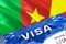 text VISA on Cameroon visa stamp in passport. passport traveling abroad concept. Travel to Cameroon concept - selective focus,3D