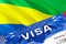 text VISA on Gabon visa stamp in passport. passport traveling abroad concept. Travel to Gabon concept - selective focus,3D