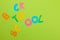 The text will return to school from multi-colored letters on a bright green background. Office tools. education. top view