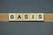 text the word basis from brown wooden small letters