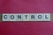 Text the word control from gray wooden small letters