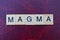 Text of word magma from gray wooden small letters