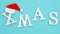 Text Xmas from volume white letters in red Santa hat and falling snow on blue background. Concept Merry christmas. Top