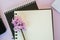 Textbook with empty place for text, copy space, office concept, beautiful blooming pink flower - hyacinth
