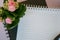 Textbook with empty place for text, copy space, office concept, beautiful defocused blooming flower kalanchoe