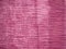 Textile background from pink wrinkled silk fabric