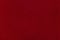 Textile background. Red velvet or corduroy. An empty and flat surface.