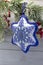 Textile christmas decoration snowflake with blue beaded embroidery  DIY handmade close up