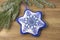 Textile christmas decoration snowflake with blue beaded embroidery  DIY handmade close up