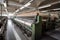 textile factory, with spinning and weaving machines in motion, producing fabrics of all kinds