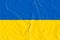 Textile flag of Ukraine. War background. Fabric texture, conflict Russia with Ukraine