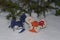 Textile mice in the snow under a tree