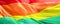 Textile rainbow flag with waves, symbol of freedom