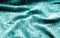 Textile texture with blur effect in cyan color