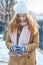 Texting everyone to come and join me in the snow. Shot of an attractive young woman using a cellphone in the snow