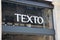 texto logo brand and text sign on wall facade storefront fashion business