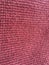 Textural abstract wallpaper. Woolen fabric of red color.