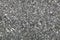 Textural decorative background from natural shiny mica of dark black and gray cold shades