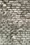 Texture of aged brick wall with cracked weathered structure white gray color close-up