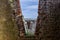 The texture of ancient brickwork with V-shaped opening in the tower Rocca of Radicofani. Tuscany, Italy