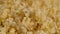 Texture of appetizing popcorn. Lots of freshly cooked hot popcorn. Close up. Concept of snack for movie.