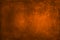 Texture for artwork and photography. Abstract burnt orange stained paper texture background or backdrop