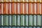 Texture background of colorful roof tiles. Closeup of colored clay roof tiles background