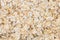 Texture background Heap of rolled oats. Closeup. Top view