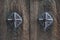 Texture background on Japanese ancient wooden door decorated with rusty metallic pins