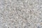 The texture background of a light granite tile interspersed with stone for design. Granite slab, marble texture