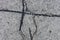 Texture background with patched cracked asphalt