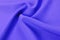 Texture, background, pattern. Lilac silk fabric. Smooth elegant