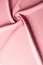 Texture background pattern. Pink silk fabric. Vintage French semi sheer crepe de chine fabric in a stunning lipstick pink color I