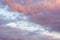 Texture, background, pattern. The sky is at sunset, dawn. Colored clouds, red, dark blue, orange, pastel colors. Romantic pastel