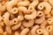 Texture background of raw italian pasta fusilli macaroni made of