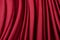 Texture, background, template. Silk fabric. Red silk drapery and upholstery fabric. Solid fabrics for backdrop, drapes, flags