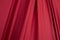 Texture, background, template. Silk fabric. Red silk drapery and upholstery fabric. Solid fabrics for backdrop, drapes, flags