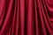 Texture, background, template. Silk fabric. Red silk drapery and upholstery fabric. Solid fabrics for backdrop, drapes, flags