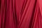 Texture, background, template. Silk fabric. Red silk drapery and upholstery fabric. Solid fabrics for backdrop, drapes, flags