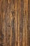 Texture and background of a very old brown wood, vertical image