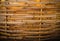Texture of bamboo weaves of  large bamboo basket which  made around tree to store dry leaves for compost