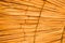 Texture of beautiful straw natural sun umbrellas from hay in a tropical desert resort, rest. The background