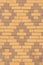 Texture of beige and brown dutch brick facade with diamond pattern