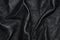 Texture of black leather rumpled