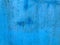 Texture, blue color. rust, damage on the metal sheet. house covering, benches. blue painted metal surface. scuffs of a metal sheet